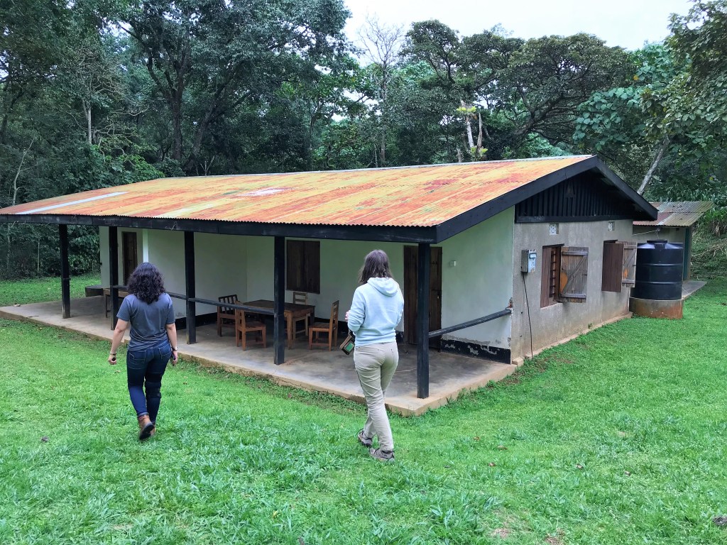 Kandra (left) and Marissa (right) walk toward our house, Kibale National Park, Uganda