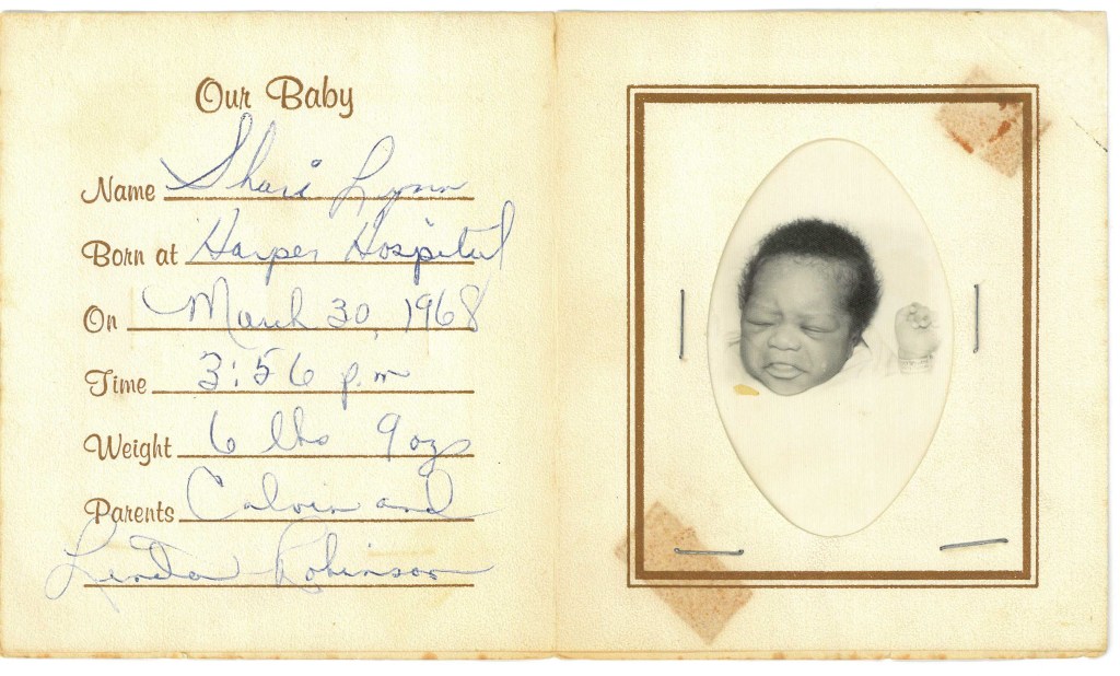 Faded, handwritten birth announcement of the author, Shari Lynn Robinson.