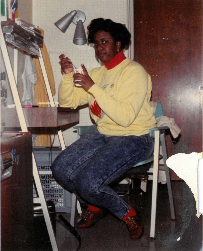 College Shari sitting at her dorm room desk at Alabama A& M.